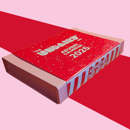Red advent calendar box with '2025' text on a pink background