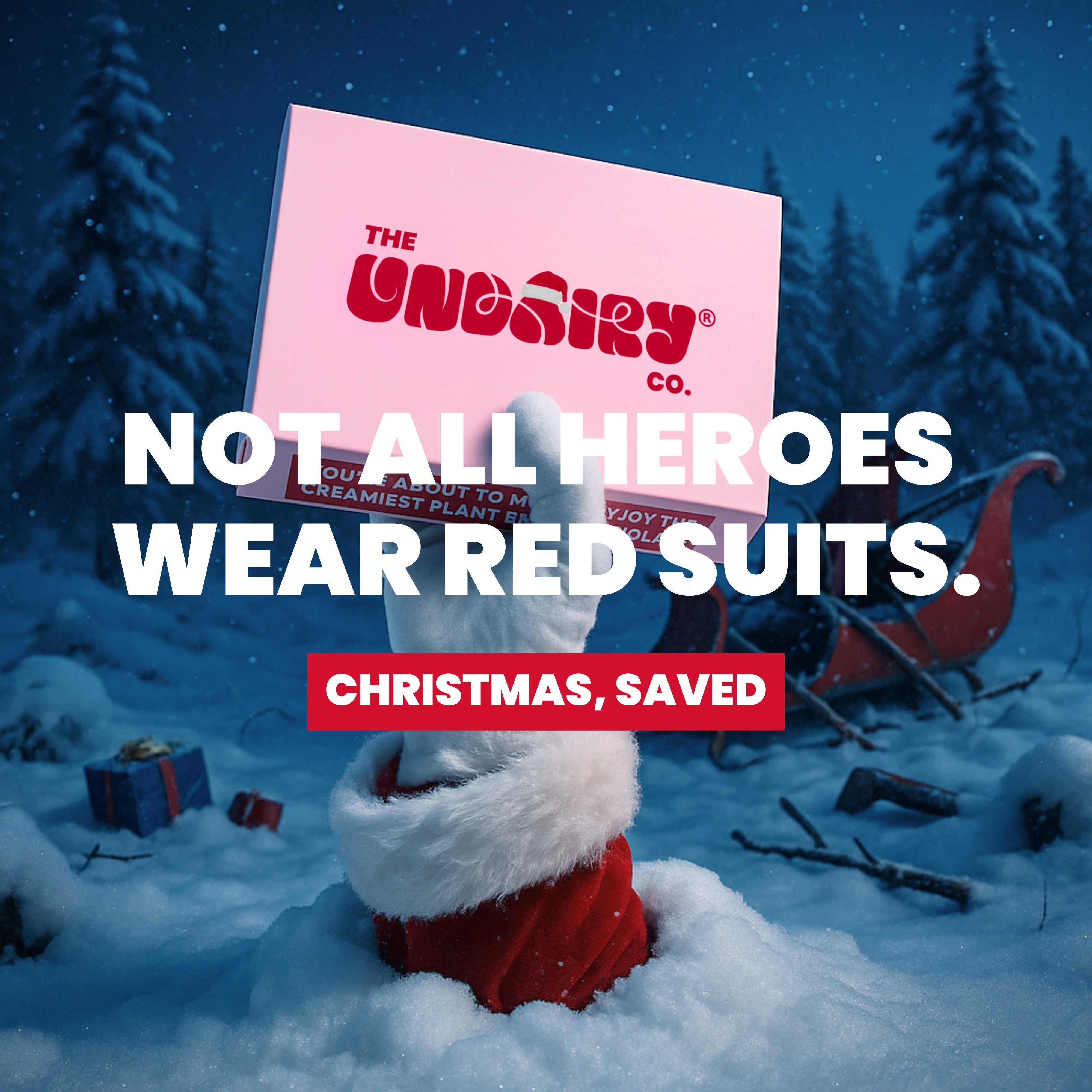 Person in red suit holding a pink box with text in a snowy landscape